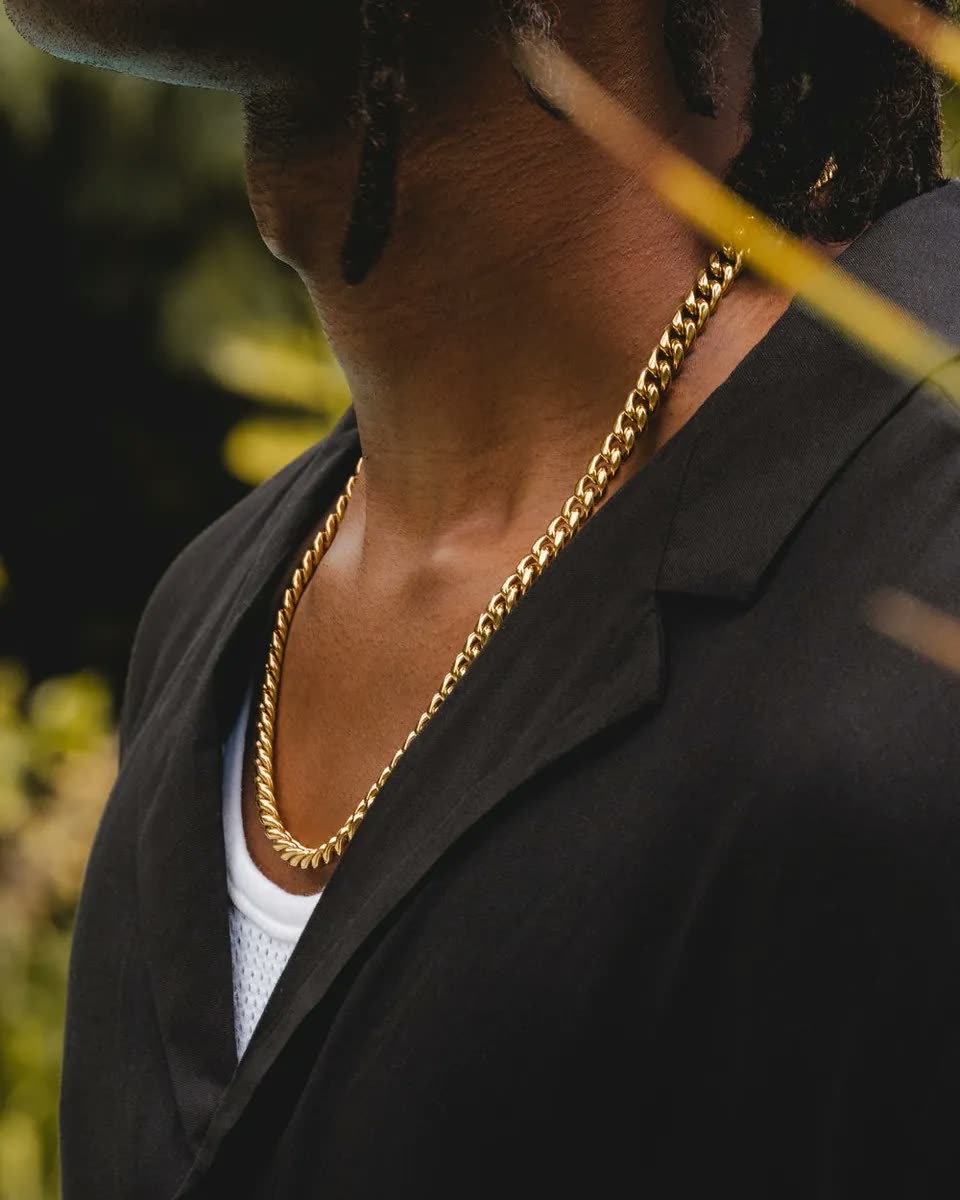 The 8mm Cuban link worn over a black shirt