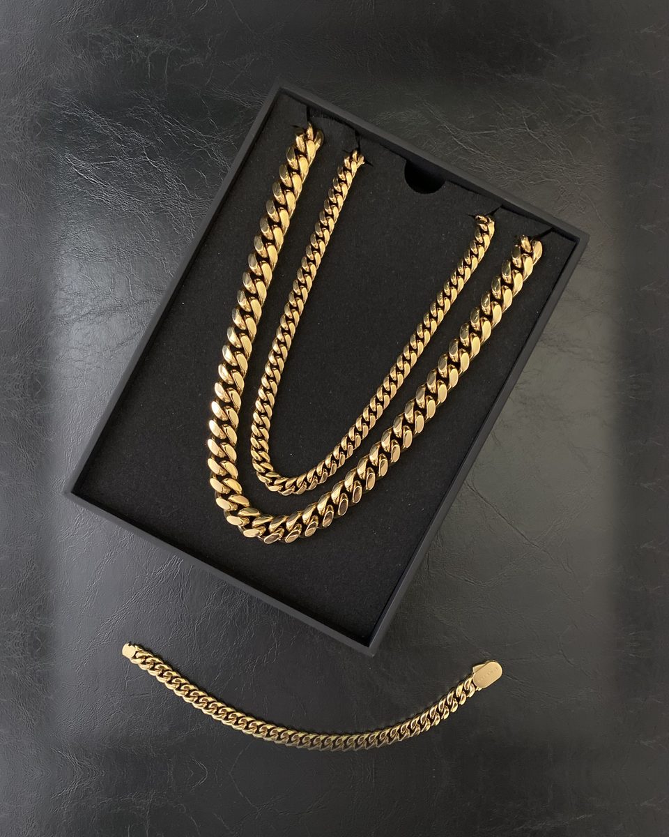 The 12mm and the 8mm Cuban link in their box, the matching 8mm bracelet beside them