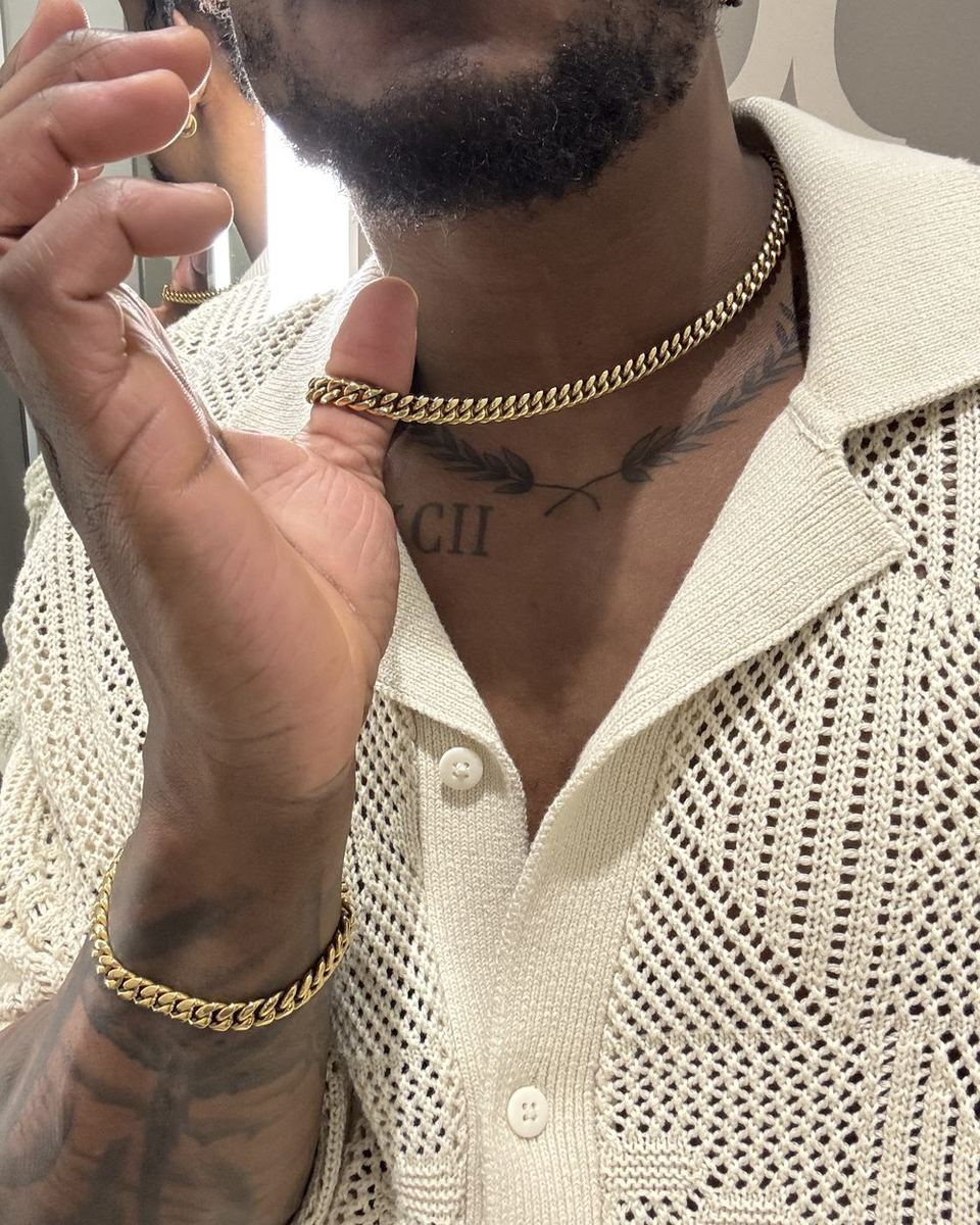The 8mm Cuban chain and the matching 8mm bracelet worn with a knit polo