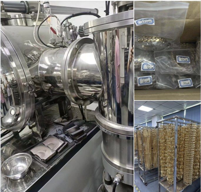 A large stainless steel PVD coating chamber standing open in a factory, beside racks of gold-coated chains hanging to cool